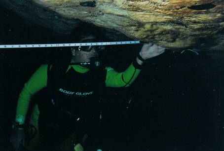 Photo 11. Alejandro Perez mapping a cenote. 